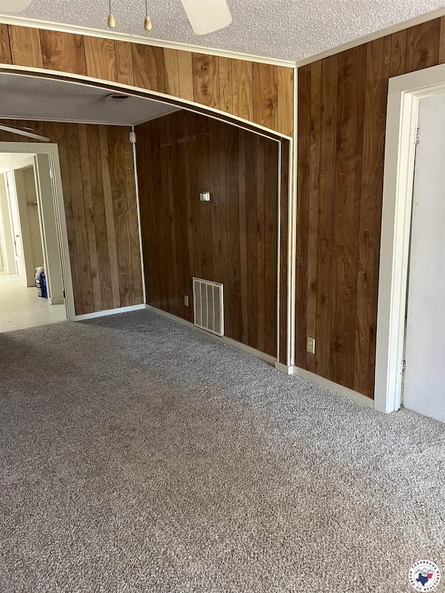 319 Crestview Rd, Texarkana, TX 75501 - unfurnished bedroom with wooden walls, carpet floors, and a closet