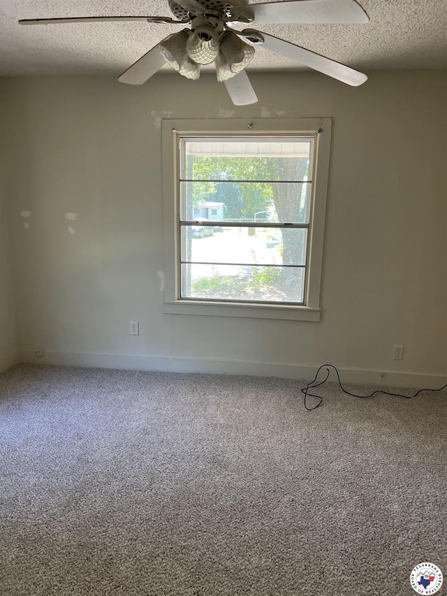 319 Crestview Rd, Texarkana, TX 75501 - empty room featuring carpet flooring, a ceiling fan, a textured ceiling, and baseboards