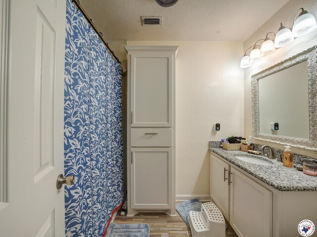 43 Broadmoor Dr, Texarkana, AR 78154 - bathroom featuring vanity and wood finished floors