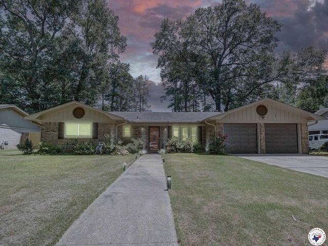 43 Broadmoor Dr, Texarkana, AR 78154 - ranch-style house featuring a garage, a front yard, concrete driveway, and brick siding