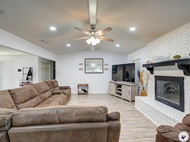 43 Broadmoor Dr, Texarkana, AR 78154 - living room featuring lofted ceiling, light wood-style flooring, a fireplace, a ceiling fan, and recessed lighting