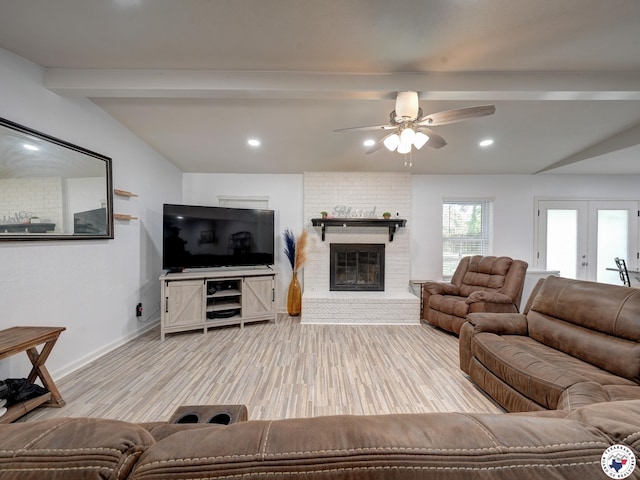 43 Broadmoor Dr, Texarkana, AR 78154 - living area with a brick fireplace, a ceiling fan, wood finished floors, recessed lighting, and french doors