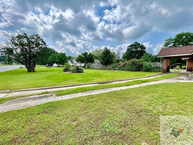 surrounding community featuring a yard