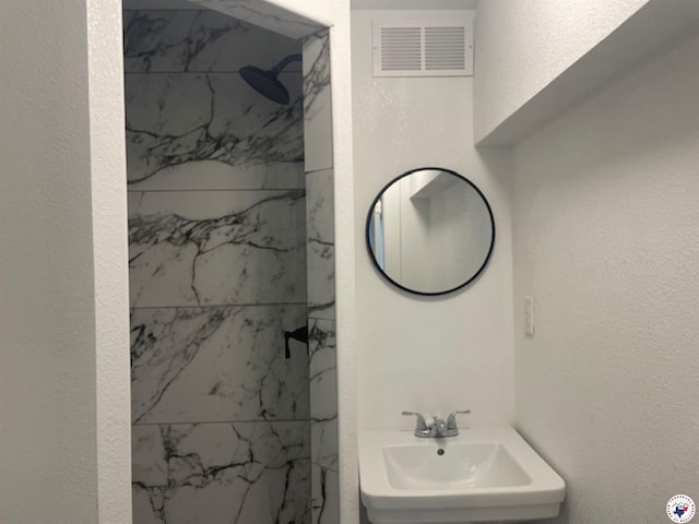 104 Pecan St, Atlanta, TX 75551 - bathroom with a sink and a marble finish shower