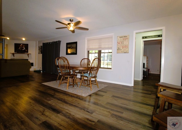 dining area with ceiling fan, a textured ceiling, and dark hardwood / wood-style floors