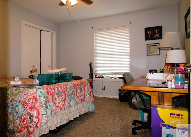 carpeted bedroom featuring a closet and ceiling fan