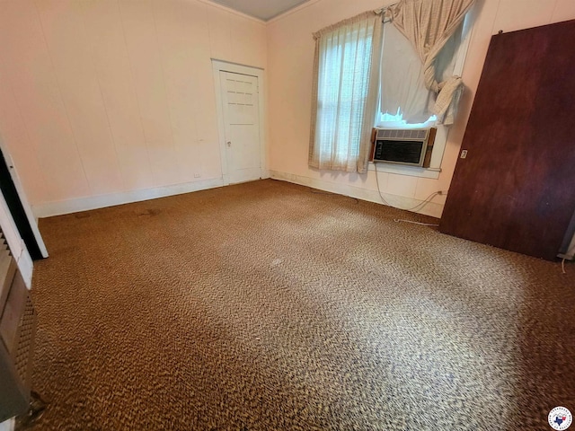 607 N Walnut St, Clarksville, TX 75426 - carpeted spare room featuring cooling unit and baseboards