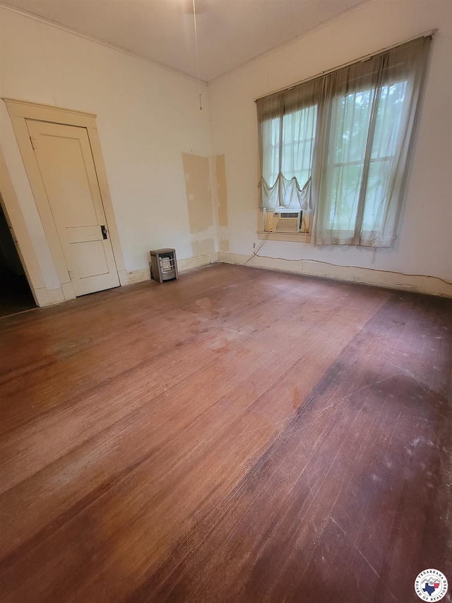 607 N Walnut St, Clarksville, TX 75426 - unfurnished room with hardwood / wood-style floors and cooling unit