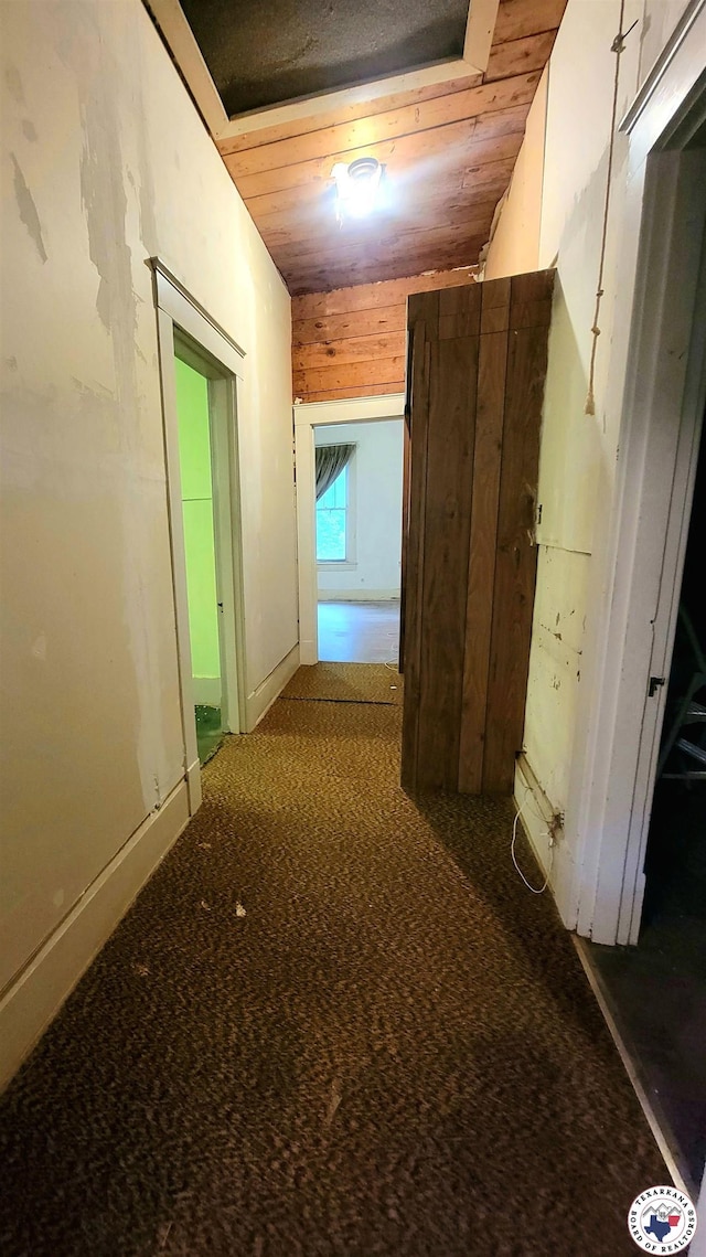 607 N Walnut St, Clarksville, TX 75426 - hall with carpet flooring and wood ceiling