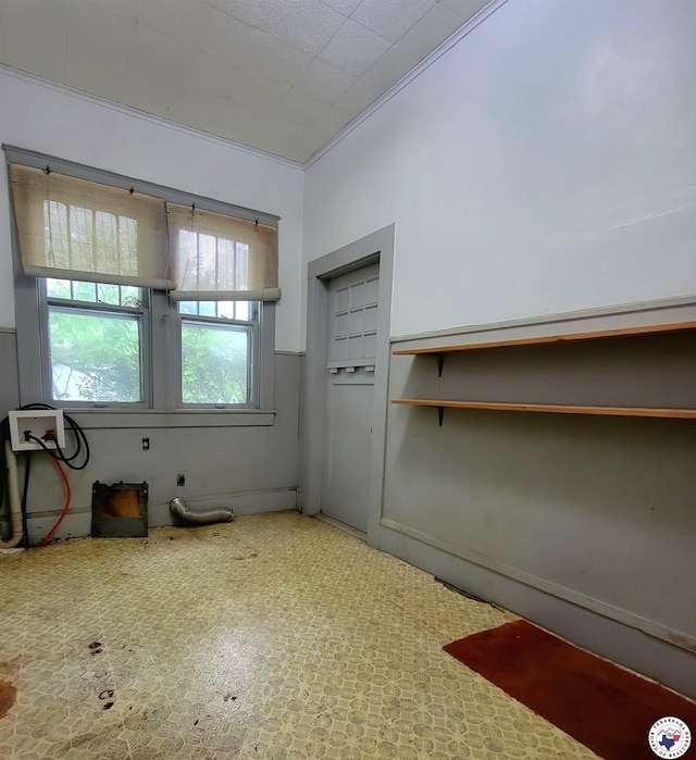 607 N Walnut St, Clarksville, TX 75426 - spare room featuring ornamental molding
