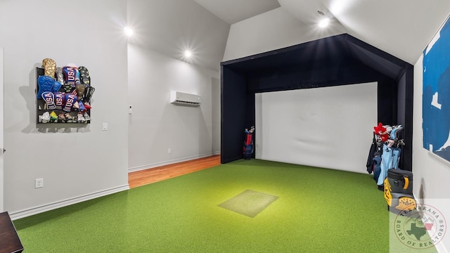 rec room with lofted ceiling, golf simulator, wood finished floors, baseboards, and an AC wall unit