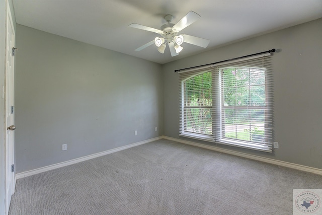 unfurnished room featuring ceiling fan and light colored carpet