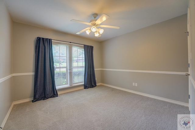 unfurnished room featuring ceiling fan and light carpet