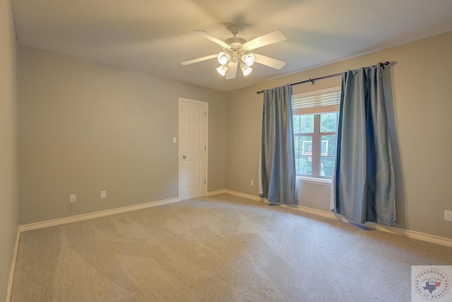 unfurnished room with ceiling fan and carpet flooring