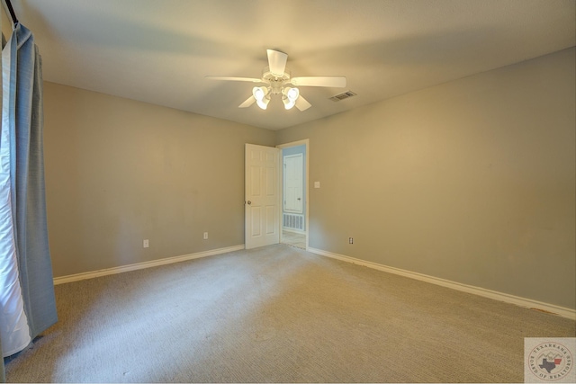 empty room with light carpet and ceiling fan