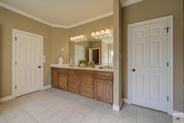 bathroom featuring tile patterned flooring, crown molding, and vanity