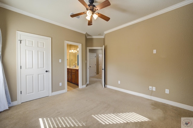unfurnished bedroom with ornamental molding, light colored carpet, baseboards, and ensuite bathroom