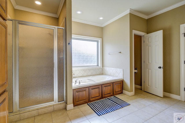 bathroom with tile patterned flooring, baseboards, ornamental molding, a bath, and a stall shower