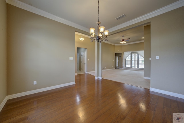 spare room featuring crown molding, hardwood / wood-style flooring, and ceiling fan with notable chandelier