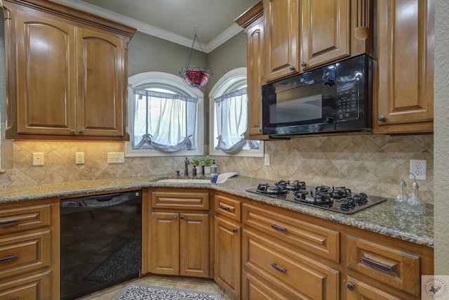 kitchen with crown molding, light stone countertops, sink, and black appliances