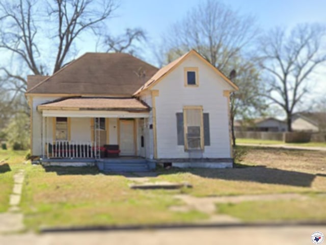 1419 Olive St, Texarkana, TX 75501 - view of front of house with a porch and a front lawn