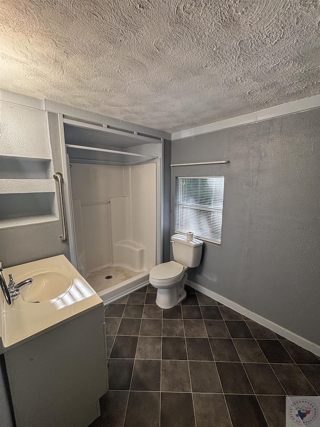 bathroom with vanity, toilet, a shower, and tile patterned floors