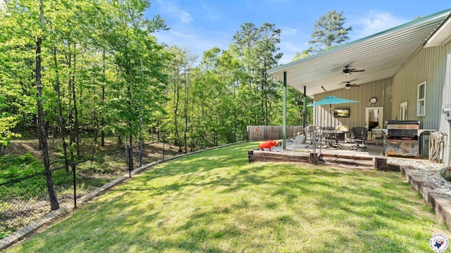 view of yard featuring a patio and fence