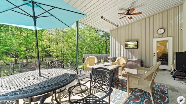 view of patio / terrace with ceiling fan, fence, and an outdoor hangout area
