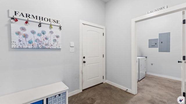 interior space featuring independent washer and dryer, baseboards, and electric panel