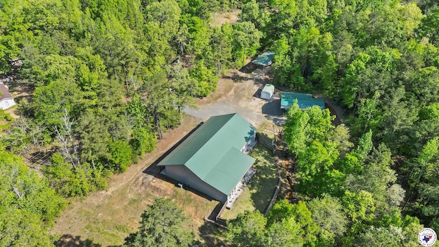 birds eye view of property with a forest view