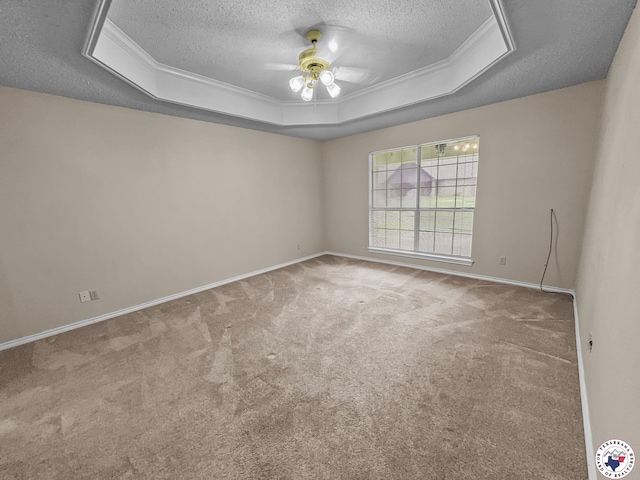 307 Kimball Cir, Wake Village, TX 75501 - empty room featuring a textured ceiling, a raised ceiling, carpet flooring, ceiling fan, and crown molding