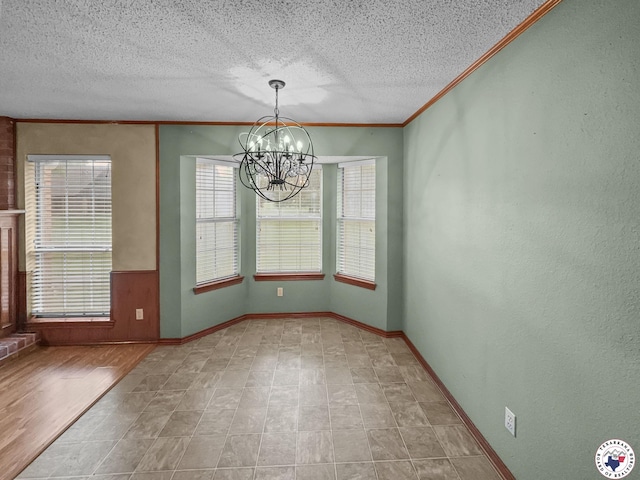 307 Kimball Cir, Wake Village, TX 75501 - unfurnished dining area with a chandelier, crown molding, a textured ceiling, and baseboards