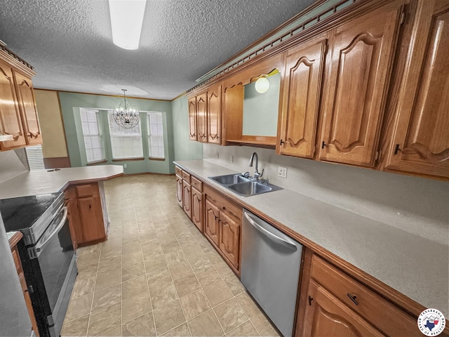 307 Kimball Cir, Wake Village, TX 75501 - kitchen with appliances with stainless steel finishes, a sink, a chandelier, a textured ceiling, and brown cabinets