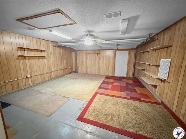 307 Kimball Cir, Wake Village, TX 75501 - finished basement featuring wood walls, ceiling fan, and a textured ceiling