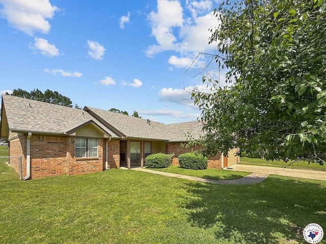 307 Kimball Cir, Wake Village, TX 75501 - ranch-style house featuring brick siding, a shingled roof, and driveway