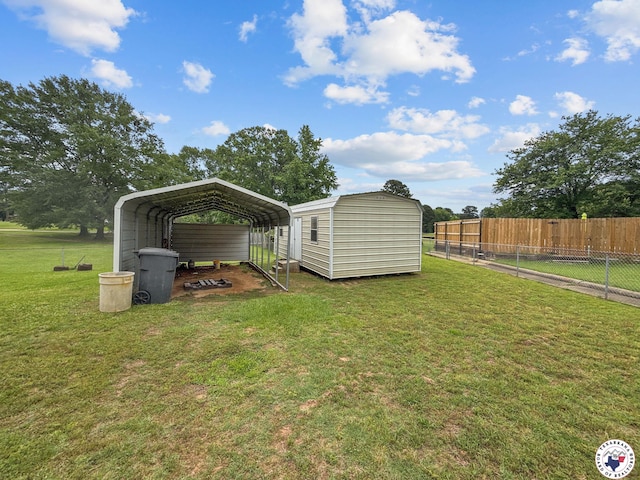 307 Kimball Cir, Wake Village, TX 75501 - view of yard with a storage shed, a carport, and an outbuilding