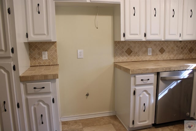 kitchen with white cabinets, dishwasher, tile countertops, and tasteful backsplash