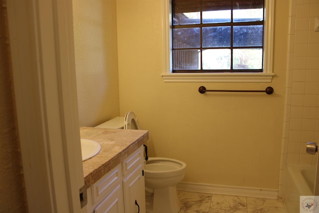 bathroom featuring toilet and vanity