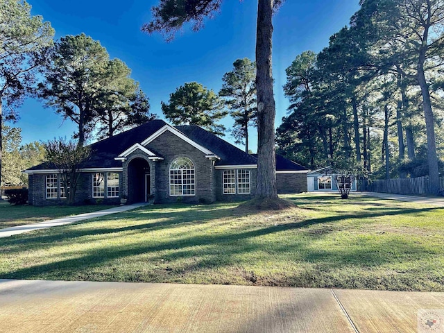 ranch-style house with a front yard