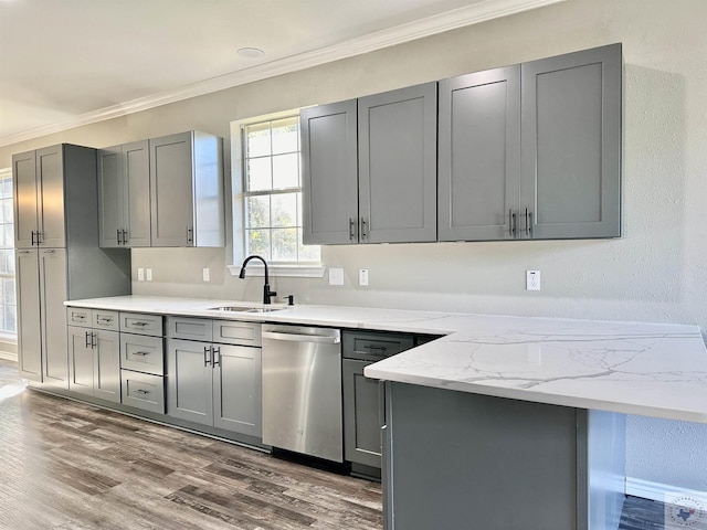 kitchen featuring sink, gray cabinets, stainless steel dishwasher, and dark hardwood / wood-style floors