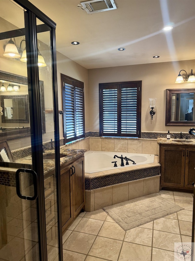 bathroom featuring vanity, visible vents, recessed lighting, a garden tub, and tile patterned floors