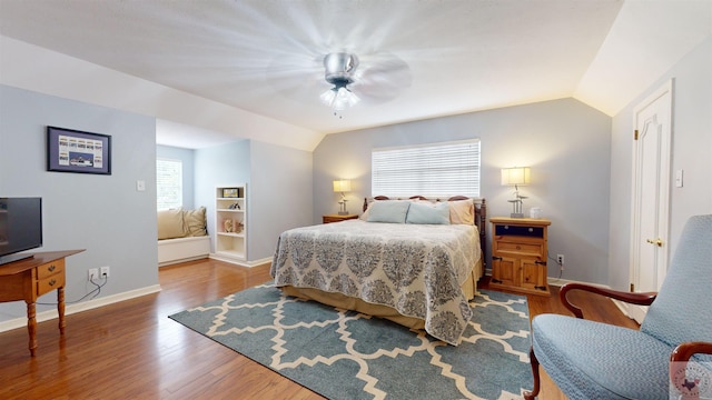 bedroom featuring wood-type flooring, lofted ceiling, and ceiling fan