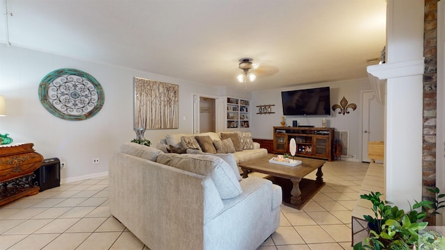 living room with crown molding and light tile patterned flooring