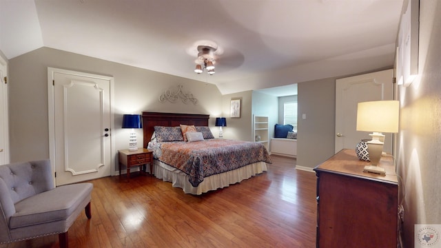 bedroom with wood-type flooring, lofted ceiling, and ceiling fan