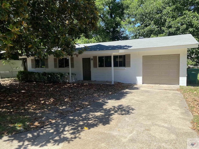 ranch-style home with a garage