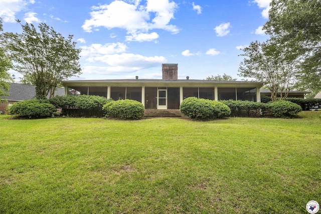 803 Lakeridge Pl, Texarkana, TX 75503 - back of property with a sunroom, a chimney, and a yard