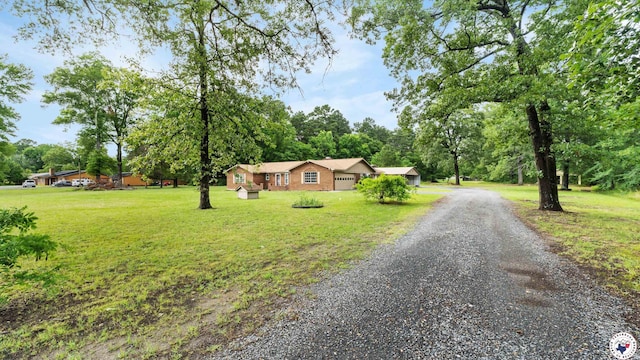 8809 N Kings Hwy, Texarkana, TX 75503 - ranch-style house featuring driveway and a front yard