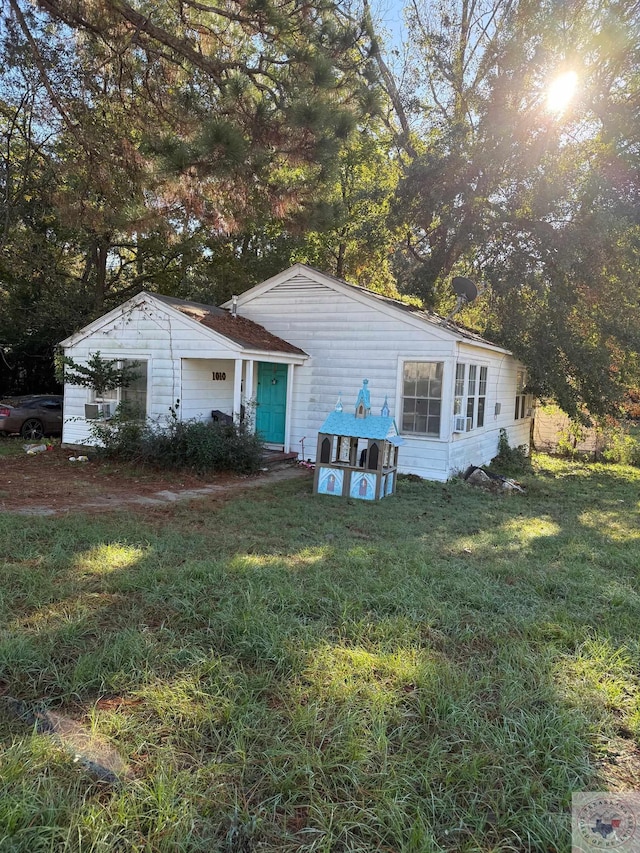 back of house with a yard