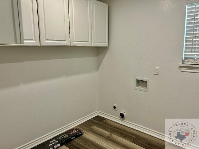 laundry area featuring electric dryer hookup, cabinets, washer hookup, and dark hardwood / wood-style flooring