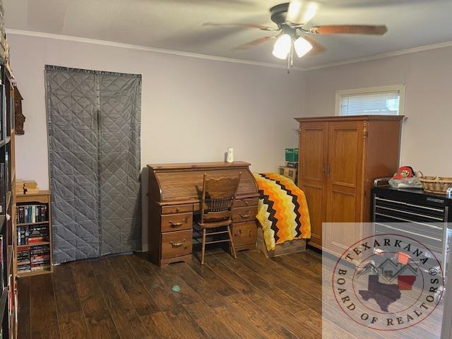 office area featuring ornamental molding, ceiling fan, and dark hardwood / wood-style flooring